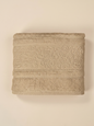 Linoa 450 Hudoo in sand 100% cotton towel, studio product shot