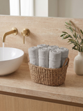 Linoa 450 Hudoo in grey 100% cotton towel, face towel folded in a woven basket