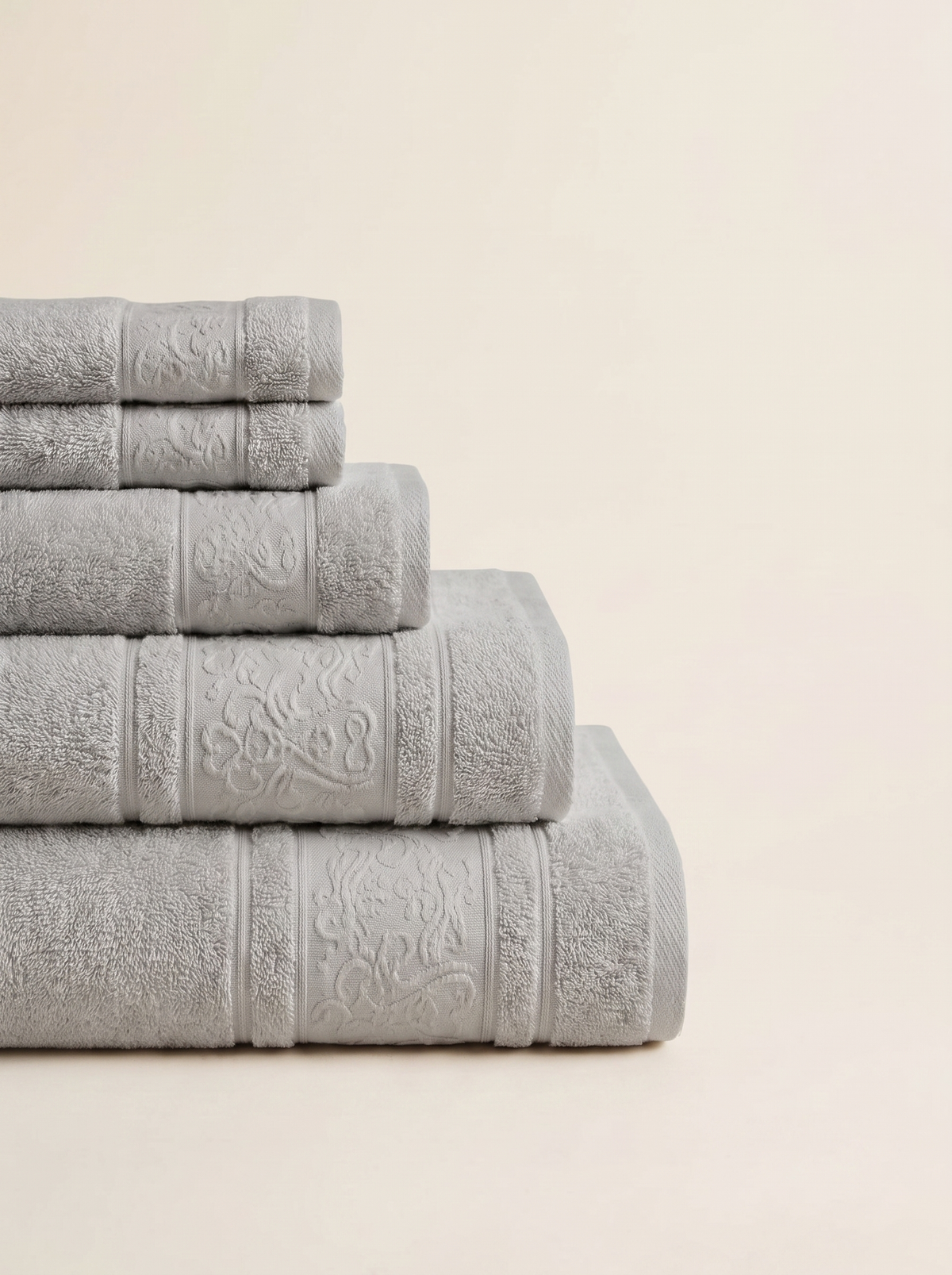 Linoa 450 Hudoo in grey 100% cotton towel, neatly folded stack