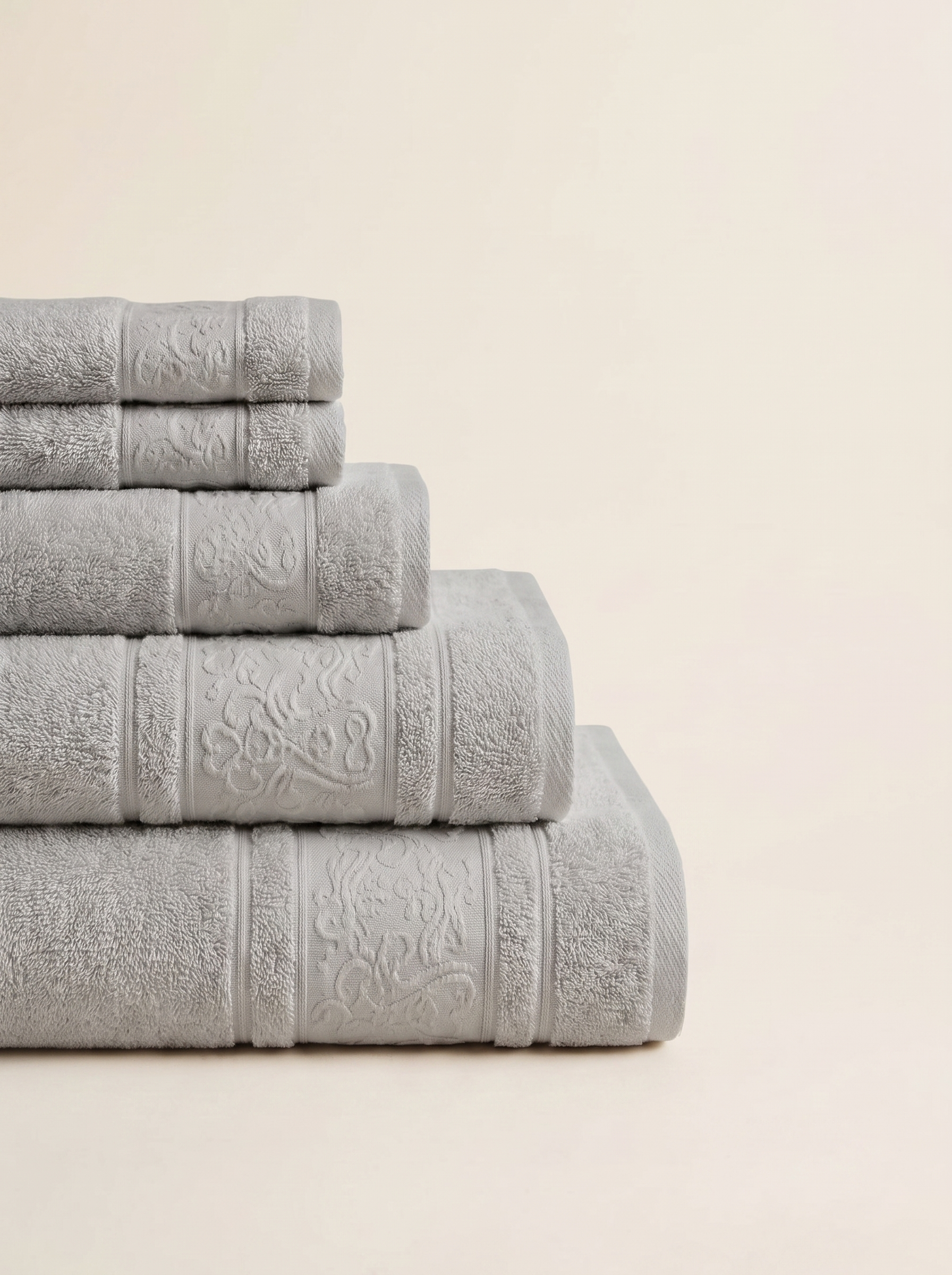 Linoa 450 Hudoo in grey 100% cotton towel, neatly folded stack