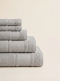 Linoa 450 Hudoo in grey 100% cotton towel, neatly folded stack