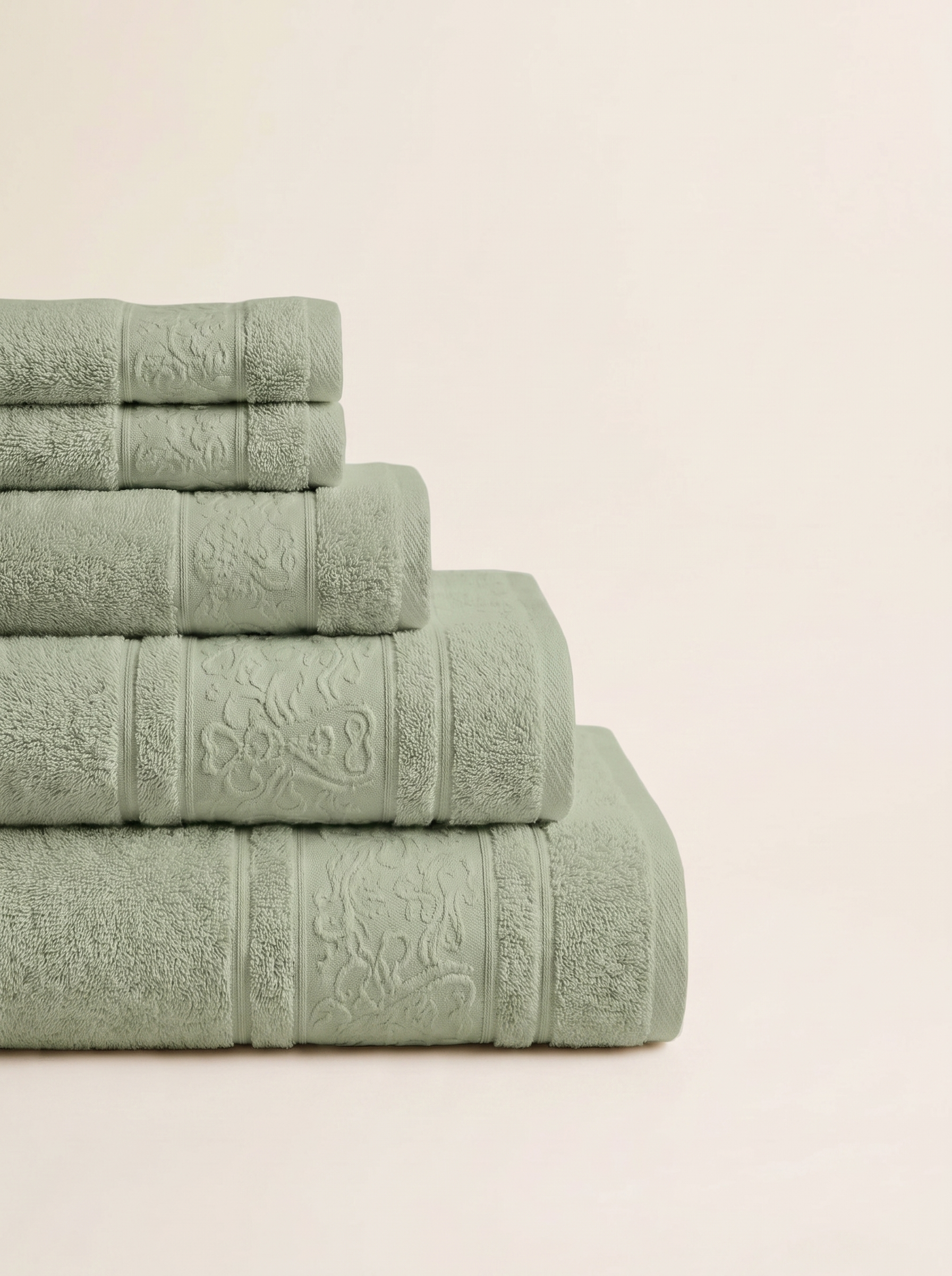 Linoa 450 Hudoo in sage green 100% cotton towel, neatly folded stack
