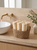 Linoa 450 Hudoo in off-white 100% cotton towel, face towel folded in a woven basket