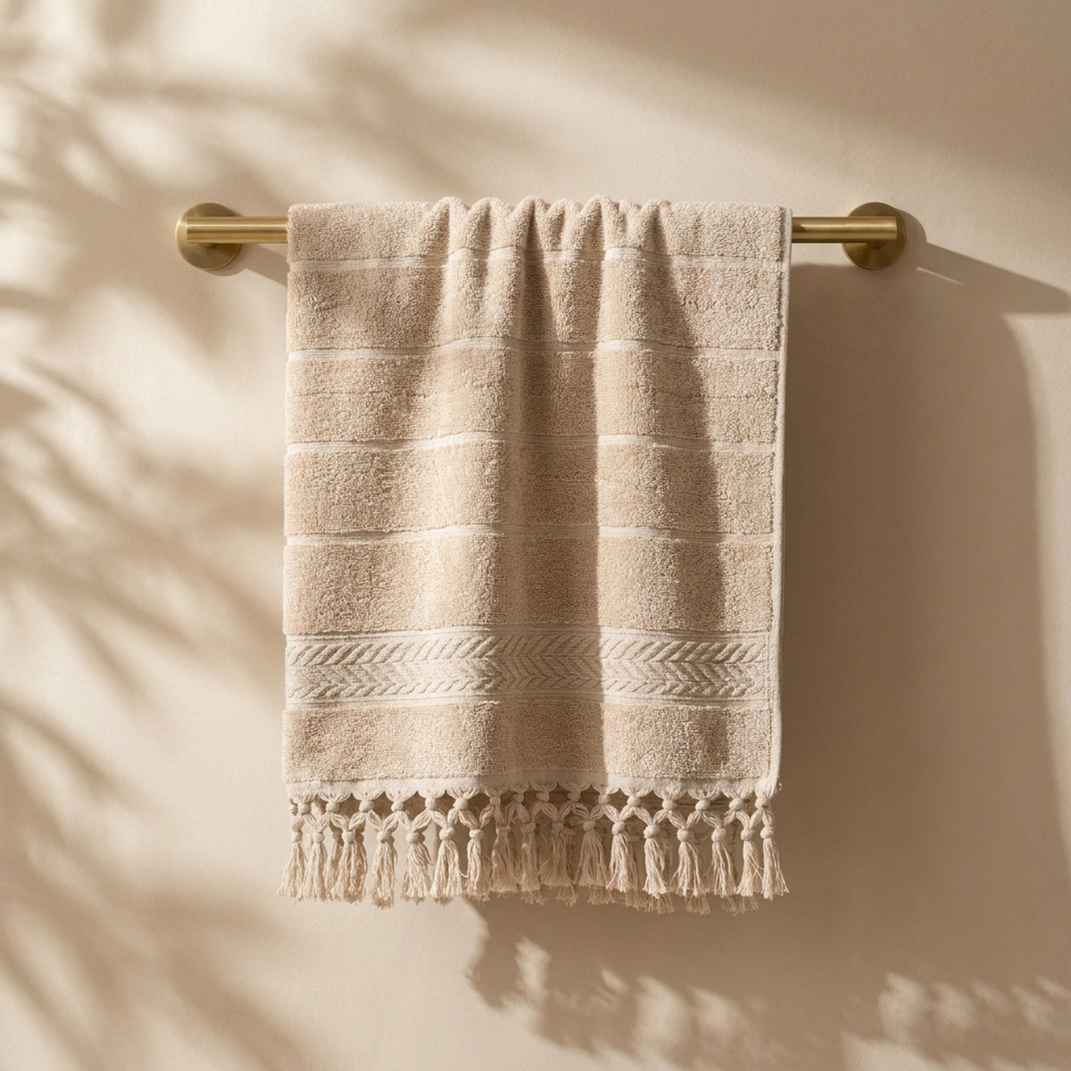 Linoa 450 Sakeena in mocha brown 100% cotton towel, draped over a rail