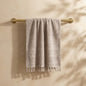 Linoa 450 Sakeena in grey 100% cotton towel, draped over a rail