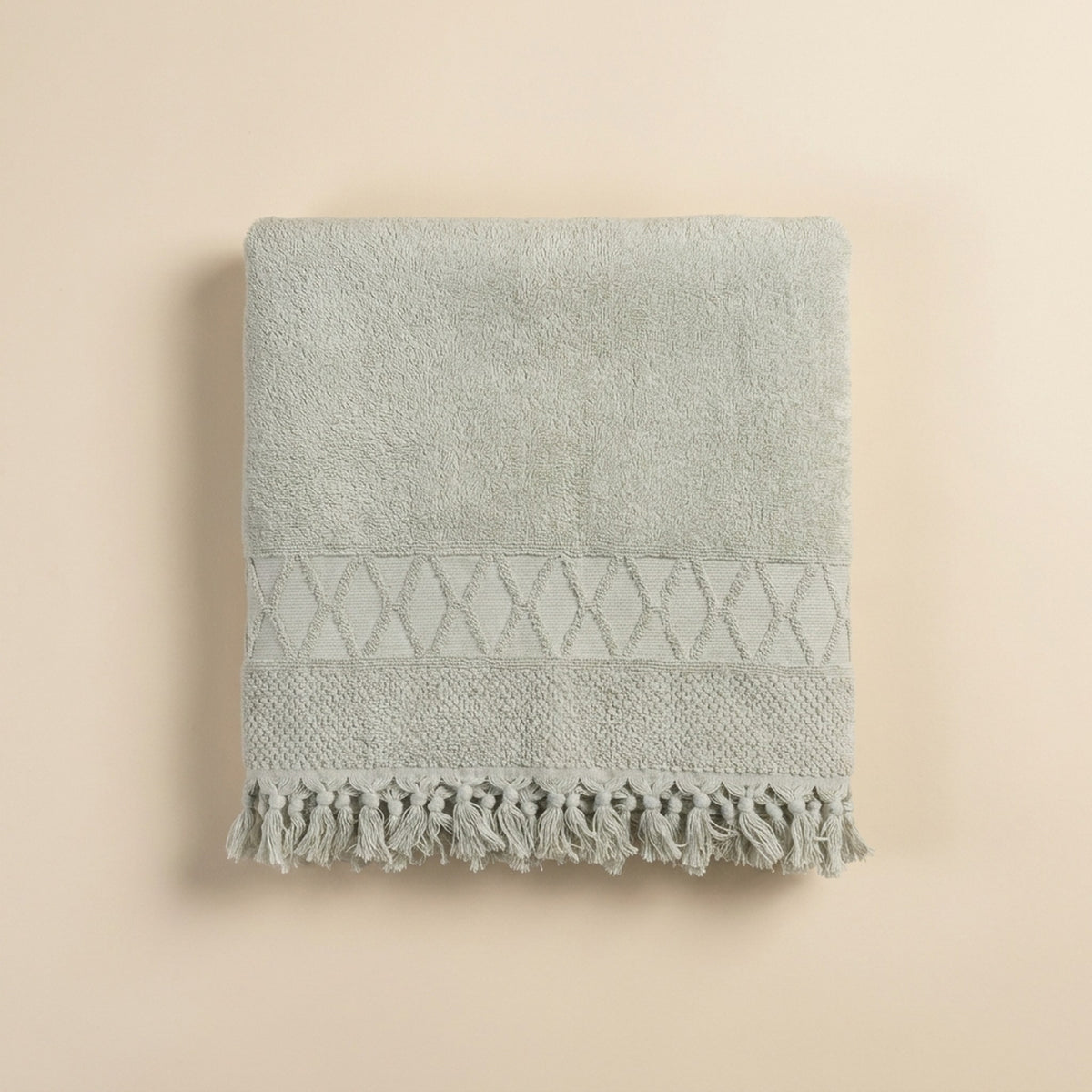 Linoa 450 Sakeena in sage green 100% cotton towel, studio product shot
