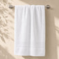 Linoa 550 Naeem in white 100% cotton towel, draped over a rail