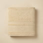 Linoa 550 Reesha Feather in off-white 100% cotton towel, studio product shot