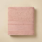 Linoa 550 Reesha Feather in blush pink 100% cotton towel, studio product shot