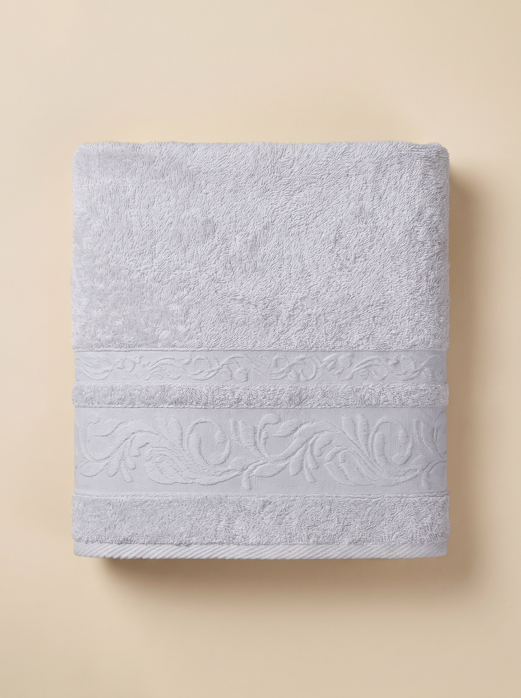 Linoa 550 Reesha Feather in white 100% cotton towel, studio product shot