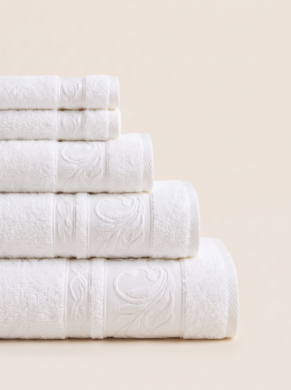 Linoa 550 Reesha Feather in white 100% cotton towel, neatly folded stack