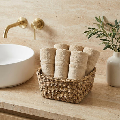 Linoa 650 Fakhm Luxe in mocha brown 100% cotton towel, face towel folded in a woven basket