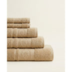 Linoa 650 Fakhm Luxe in mocha brown 100% cotton towel, neatly folded stack