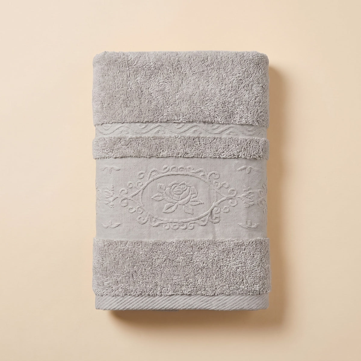 Linoa 650 Fakhm Luxe in grey 100% cotton towel, studio product shot, rose-medallion border