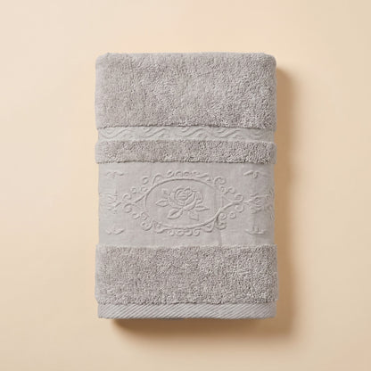 Linoa 650 Fakhm Luxe in grey 100% cotton towel, studio product shot, rose-medallion border