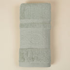 Linoa 650 Fakhm Luxe in sage green 100% cotton towel, studio product shot
