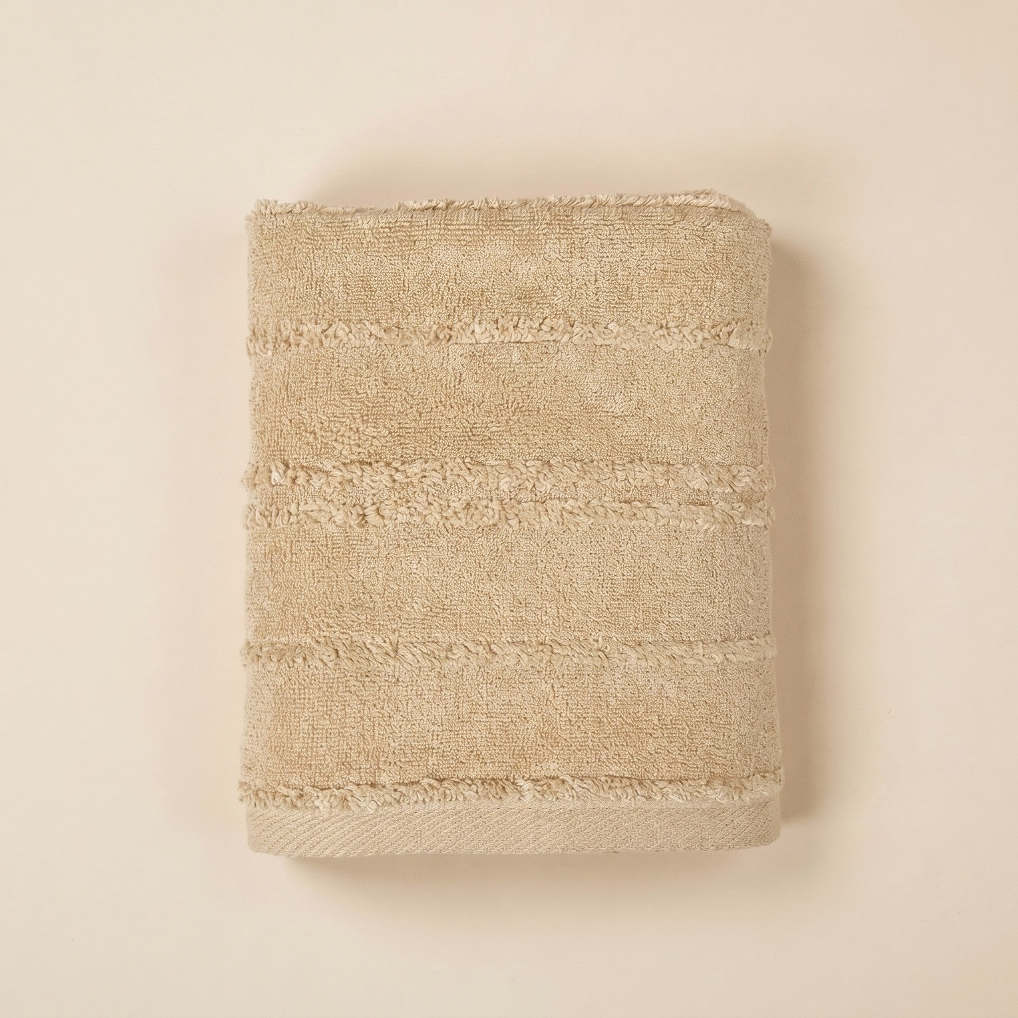 Linoa 650 Naem+ Spa in sand tan 100% cotton towel, studio product shot