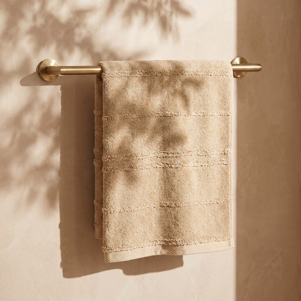 Linoa Naem+ Spa sand towel draped, tufted stripe weave