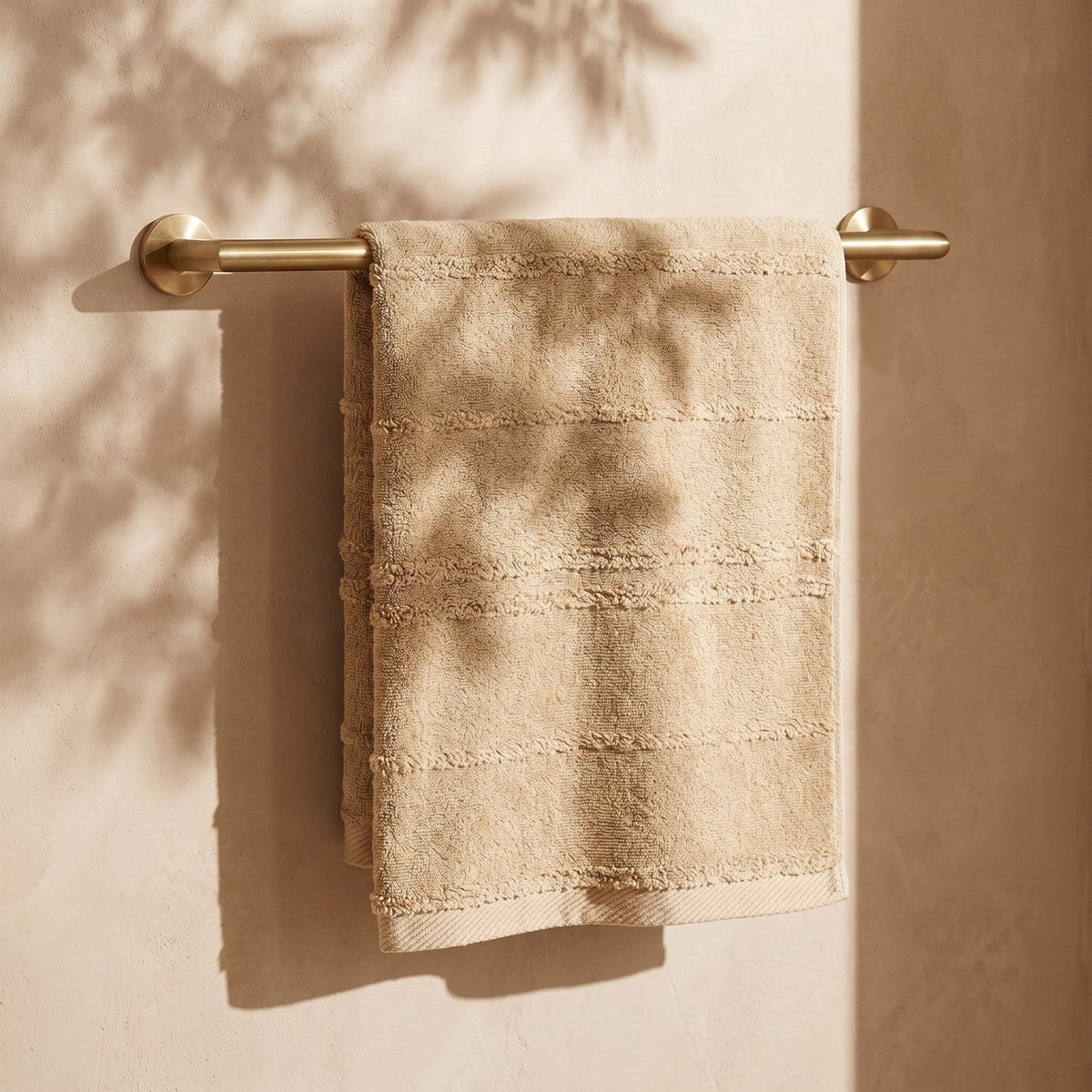 Linoa Naem+ Spa sand towel draped, tufted stripe weave