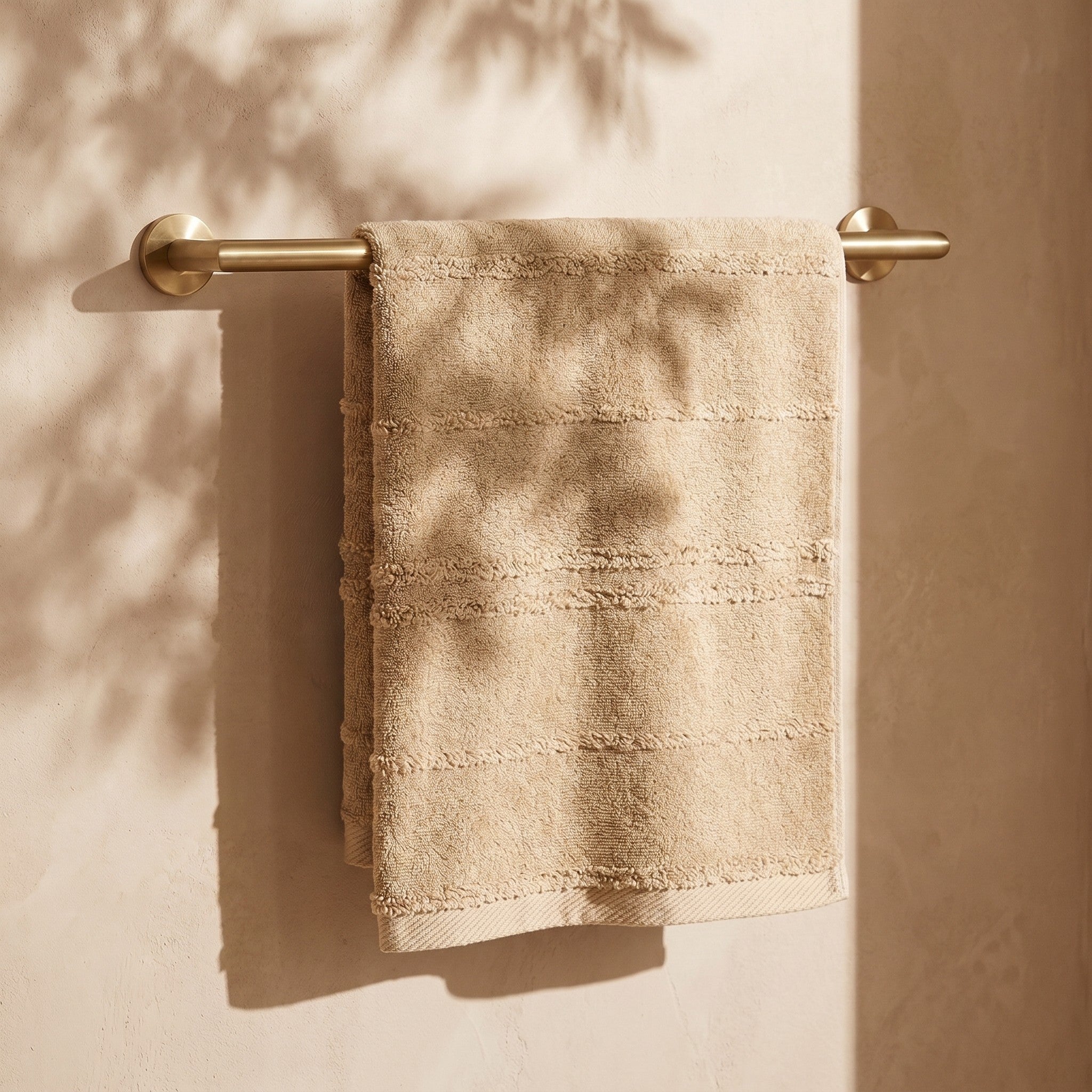 Linoa Naem+ Spa sand towel draped, tufted stripe weave