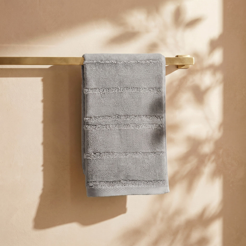 Linoa Naem+ Spa grey towel draped, tufted stripe weave