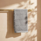Linoa 650 Naem+ Spa in grey 100% cotton towel, draped over a rail