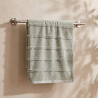 Linoa 650 Naem+ Spa in sage green 100% cotton towel, hanging on a rail