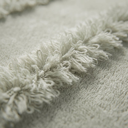 Linoa 650 Naem+ Spa in sage green 100% cotton towel, macro close-up of the raised tufted stripe weave