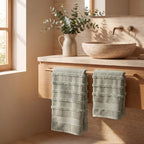 Linoa 650 Naem+ Spa in sage green 100% cotton towel, styled bathroom scene