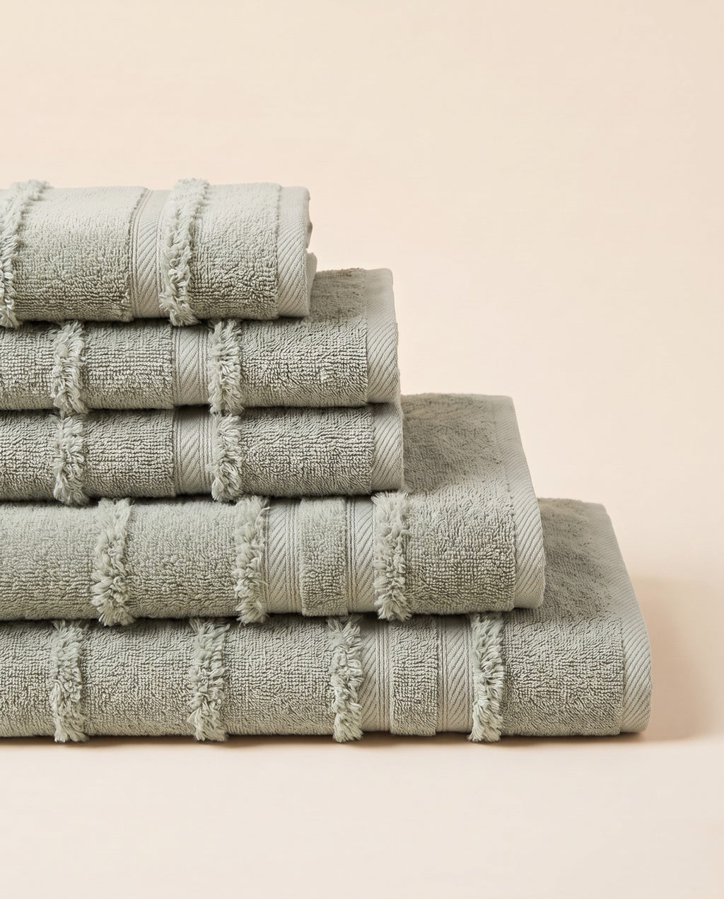 Linoa 650 Naem+ Spa in sage green 100% cotton towel, neatly folded stack