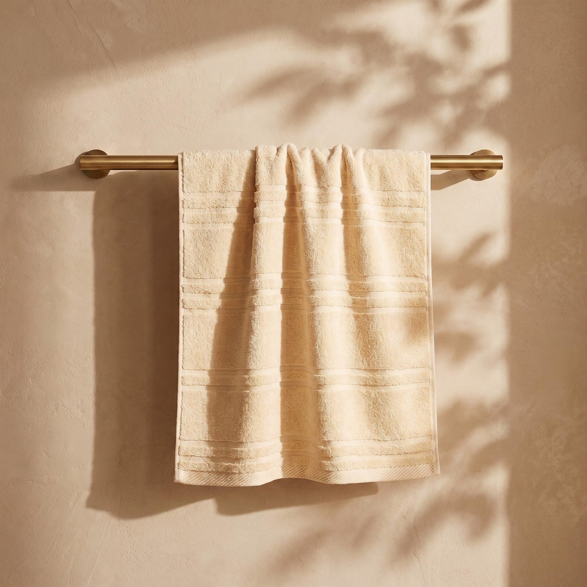 Linoa Naem+ Spa cream towel draped, tufted stripe weave