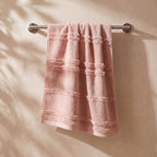 Linoa 650 Naem+ Spa in blush pink 100% cotton towel, hanging on a rail
