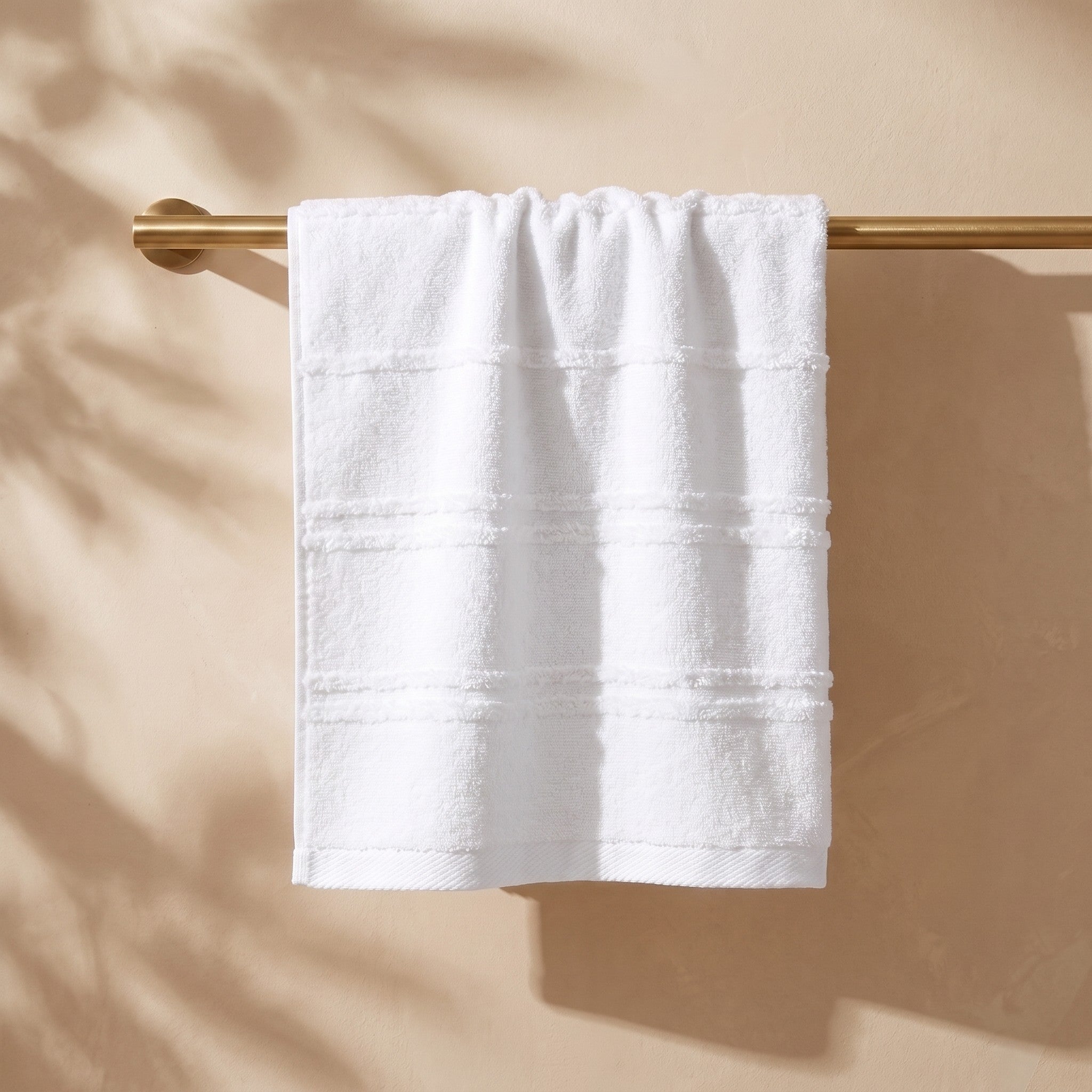 Linoa Naem+ Spa white towel draped, tufted stripe weave