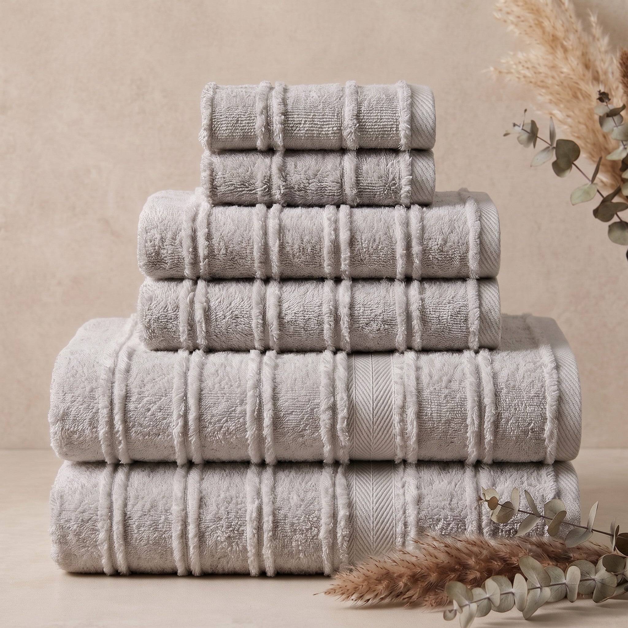 Linoa Signature Naem+ towel set in grey, folded stack, tufted stripe weave