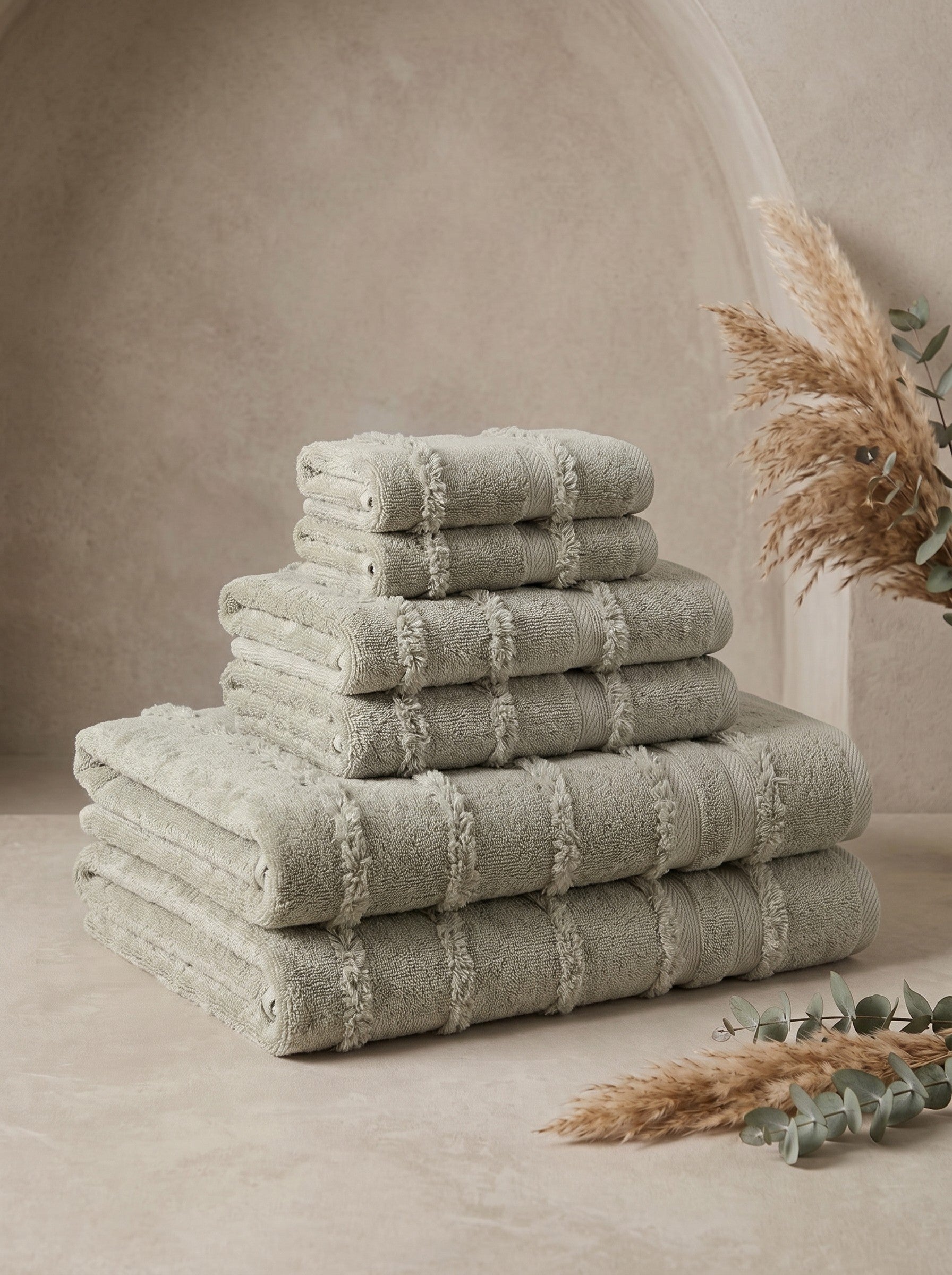 Linoa Signature Naem+ towel set in sage, folded stack, tufted stripe weave