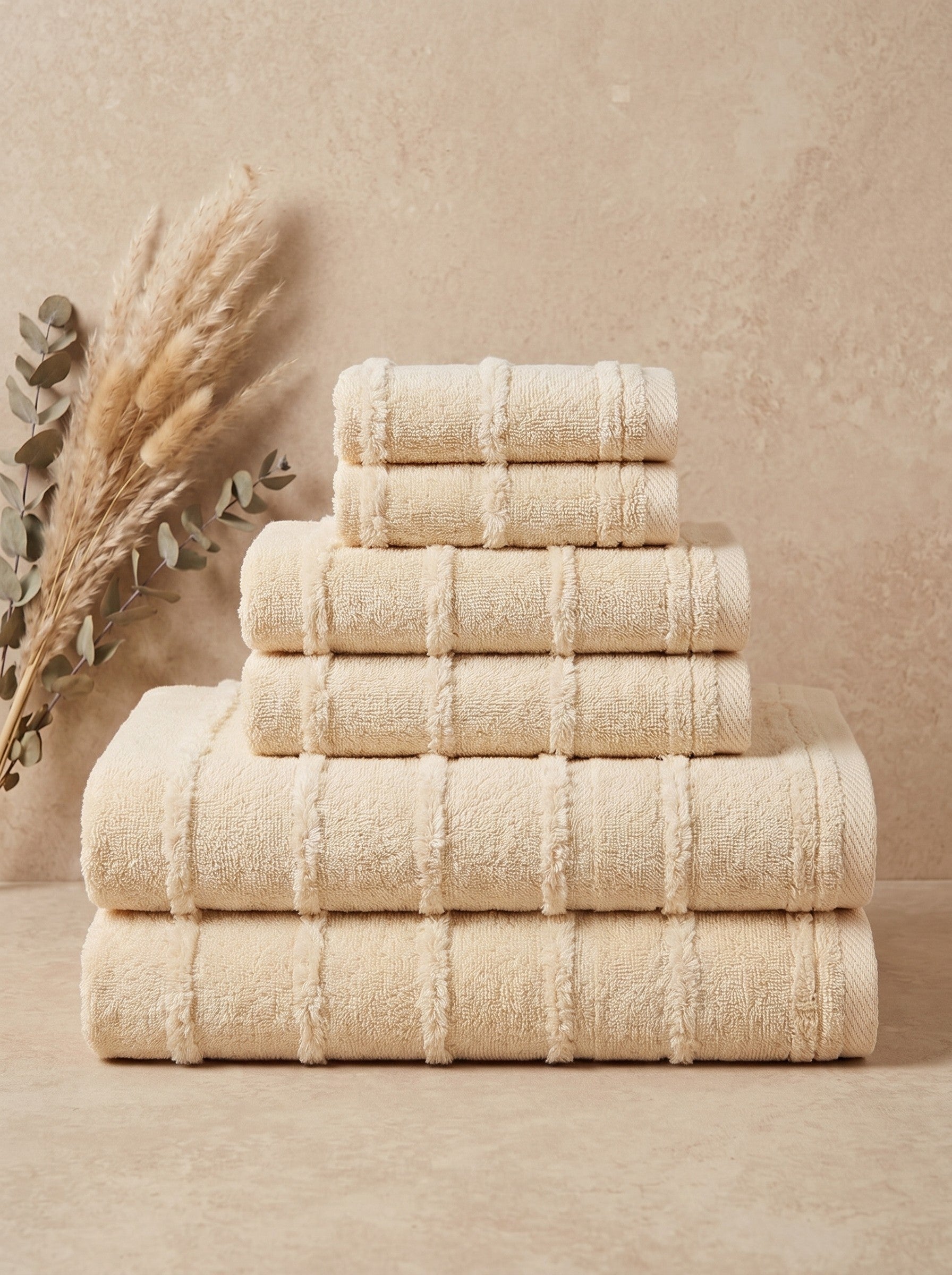 Linoa Signature Naem+ towel set in cream, folded stack, tufted stripe weave