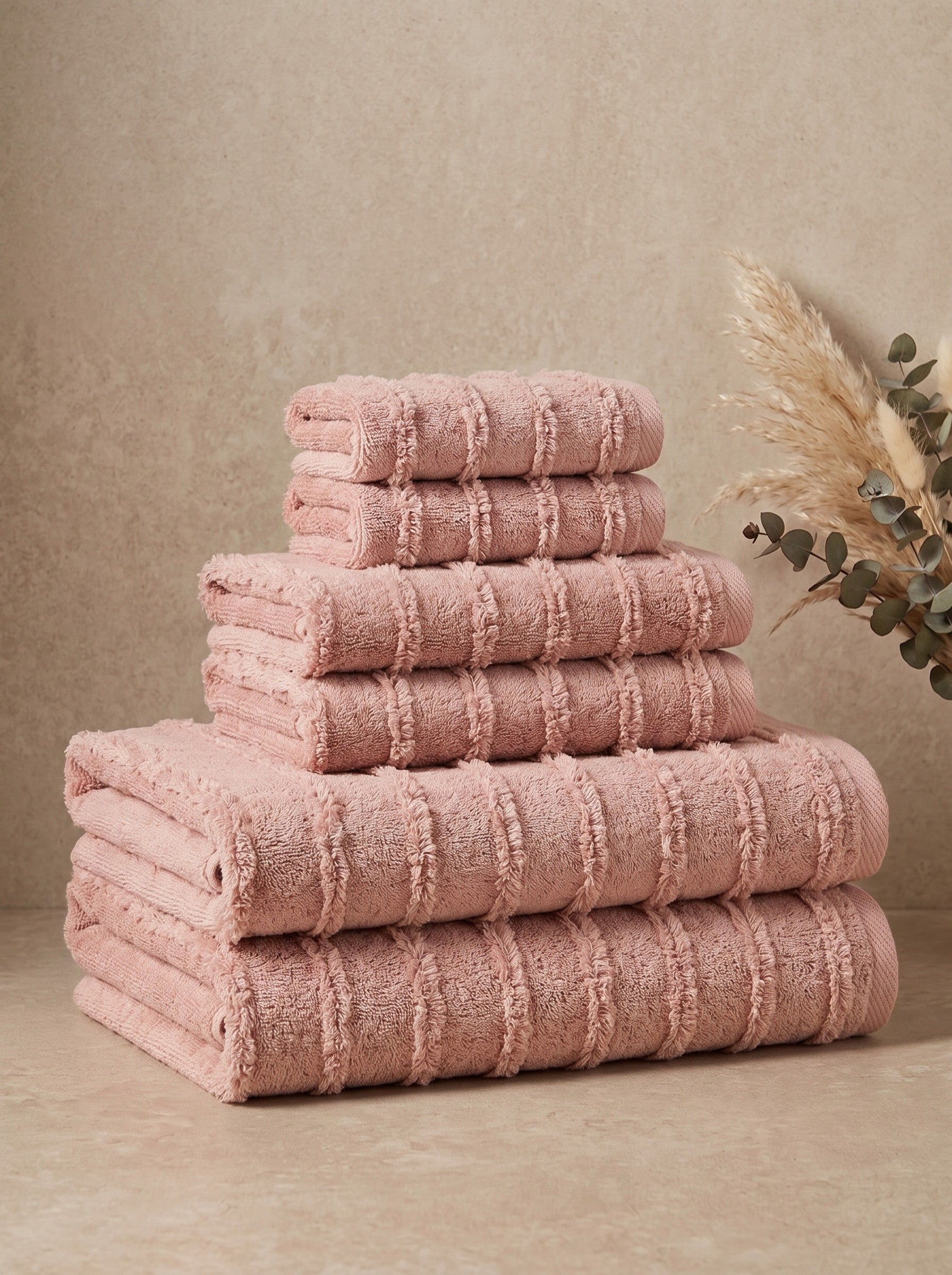 Linoa Signature Naem+ towel set in blush pink, folded stack, tufted stripe weave