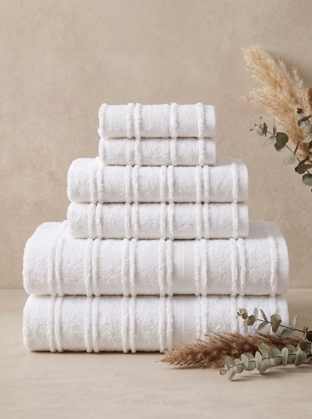 Linoa Signature Naem+ towel set in white, folded stack, tufted stripe weave